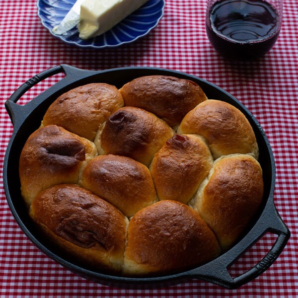 10.25 Inch Seasoned Cast Iron Baker's Skillet with some buns in it